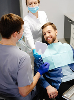 woman visiting Anthem dentist smiling in chair